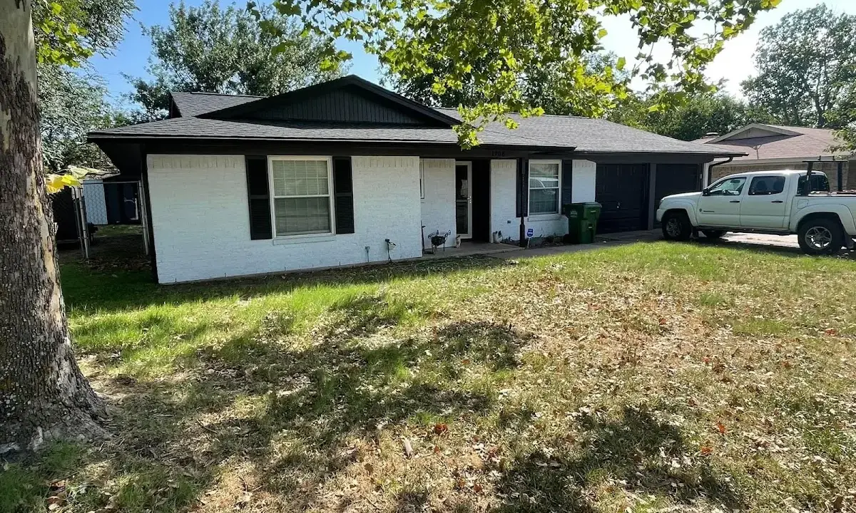 Professional roofing crew working on a residential roof in Ipswich